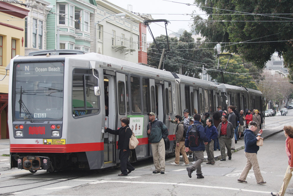 Residents get on and off a cable car